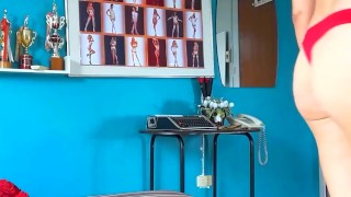 An elegant lady employee in red lingerie undresses in the office. Camera 4