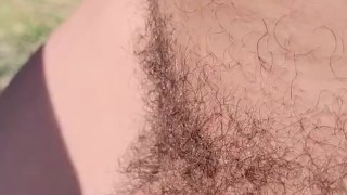 Johnholmesjunior flashing his monster cock with a huge load of cum on it at vancouvers nude beach