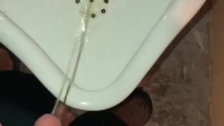 Girl Pissing into a Urinal & her Husband gets to Witness it first hand as he pisses right after her