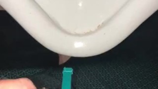 Using a hollow Cock Sleeve Packer Device to go Pee into a Urinal for the first time