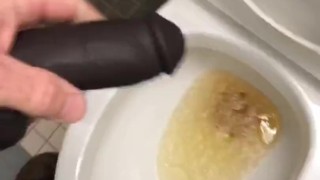 POV Pissing thru my hollow cock sleeve device in a public washroom then tasting the last few P drops