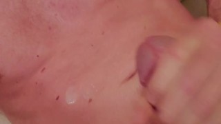 Blowing a load onto myself and grunting from the orgasm
