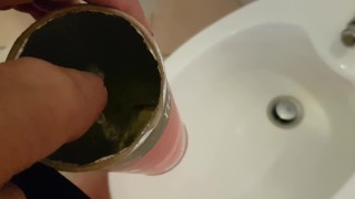 Boy pisses in the tube of pringles