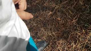 Boy piss in the pine forest THERE ARE PEOPLE IN THE BEACH NEAR HIM