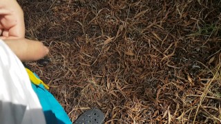 Boy piss in the pine forest THERE ARE PEOPLE IN THE BEACH NEAR HIM