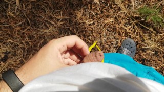 Boy piss in the pine forest THERE ARE PEOPLE IN THE BEACH NEAR HIM