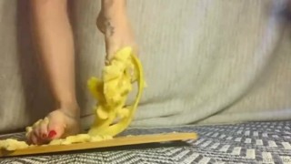 Crushing a banana between toes
