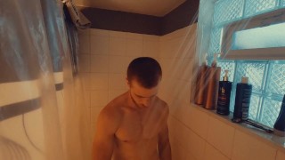 Redhead amateur edges his partially hard cock and moans for you after taking a shower
