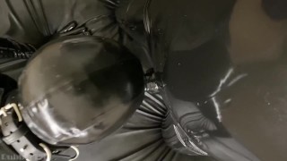 RUBBER GIMP GIVING ORAL TO RUBBER COCK