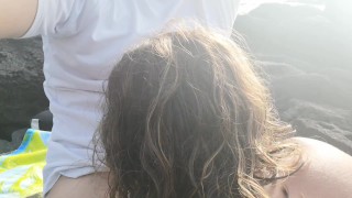 Risky Public blowjob on the beach near the people