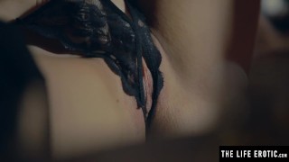 Watching herself in the mirror as she masturbates to an orgasm