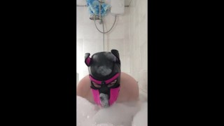 Puppy splash about in bath