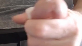 Rubbing one out watching porn with milky load