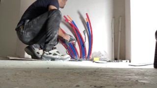 Perverted plumber gets horny while he's working on radiator plumbing in construction