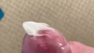 Jerking a load in condom