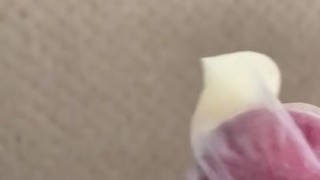 Jerking a load in condom