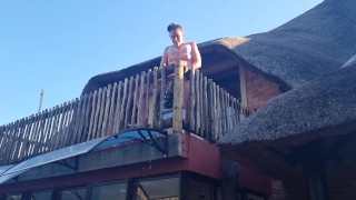 Bikini slut pissing from a balcony