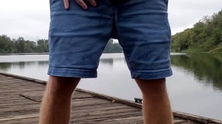 Redbull piss outside at the river, on the dock