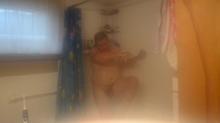 Getting cleaned up in the shower after getting very muddy and dirty