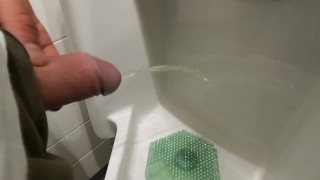 peeing at urinal