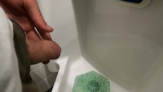peeing at urinal