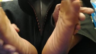 shy Plague Doctor showing off black socks and feet