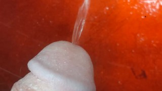 Uncut boy peeing in sink