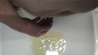 Pissing into the sink and into the foreskin