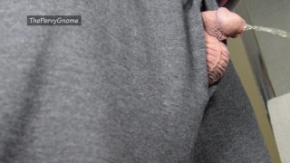Small cut cock taking a pee