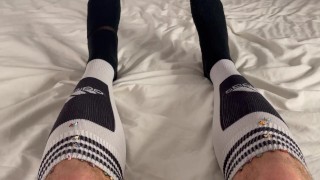 Macrophilia - tiny people hide in giants football socks