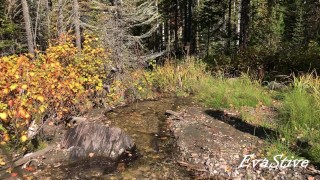 Redhead mom in rubber boots pissing in the stream