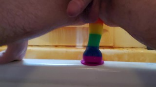 Riding rainbow dildo after shower