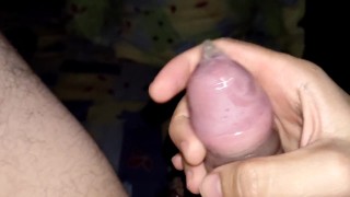 Jerking off with condom and cumshot
