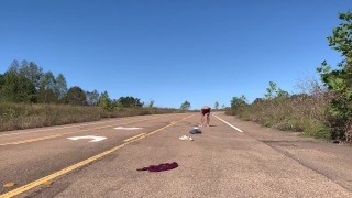 Stripping naked on a public road and jacking off before getting dressed again.