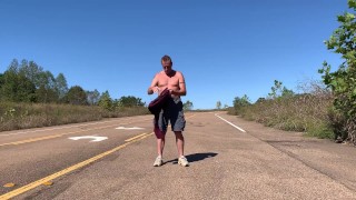 Stripping naked on a public road and jacking off before getting dressed again.
