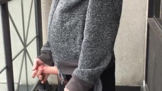 Skinny exhibitionist shows boner on public Toronto balcony while smoking