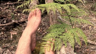 In the deep bush land where no one goes is a man playing with his extra long toes - MANLYFOOT