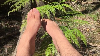 In the deep bush land where no one goes is a man playing with his extra long toes - MANLYFOOT