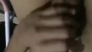 Masturbating