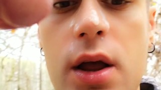 Licking last drops of cum from cock after getting facial outdoor