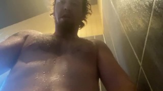 gym showers. Construction worker letting out a load after this work out