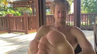 Footmaster relaxes outside 