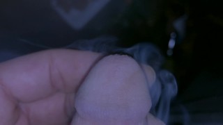 Pissing with my cigarette still smoking between my fingers