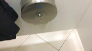 Jerking off a thick dick in a public toilet