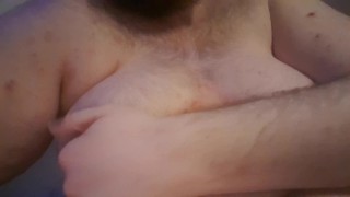 Chubby plays with his fat tits