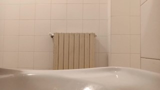 without hands pissing in a public toilet