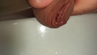 extreme close up foreskin of uncutted cock while peeing