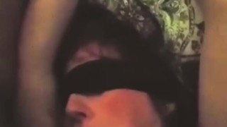 Hands tied down. I shove my cock down her throat 