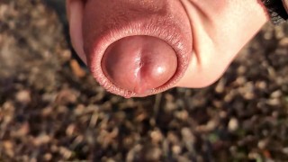 Uncut cock cums close up outside