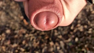 Uncut cock cums close up outside